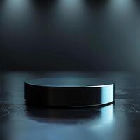 An empty black round table on a dark floor photo
