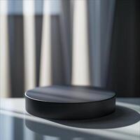 A black circular object sitting on a table photo