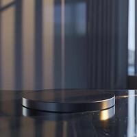 A black round table with a glass top on it photo