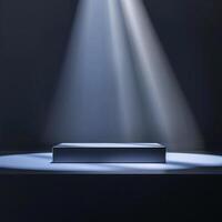 An empty stage with light shining from the top photo