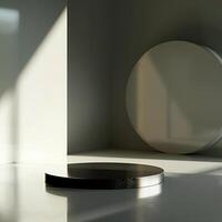 A white room with a round table and a black object photo