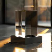 A glass cube sitting on a table in front of a large window photo