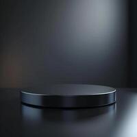 An empty black round table on a dark background photo