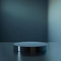 A black round object on a table in front of a dark background photo