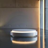 A white circular object on a table in a dark room photo