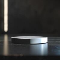 A white object on a table in front of a dark background photo