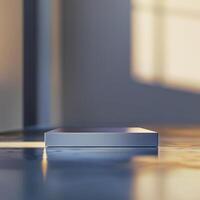A white box sitting on a table in front of a window photo