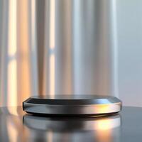 A silver object on a table with a curtain in the background photo