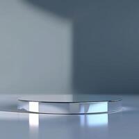 A round table with a silver surface on a white surface photo