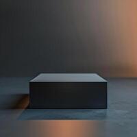 A black box sitting on a table in front of a wall photo