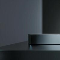 A black box with a silver top on a table photo