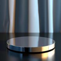 A round silver plate on a table with a curtain in the background photo