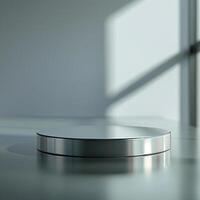 A silver round object sitting on a table photo
