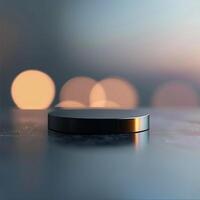 A black object sitting on a table with a blurred background photo