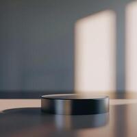 A black object sitting on a table in front of a window photo