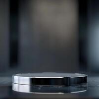 An empty round table on a black surface photo