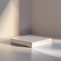 A white box sitting on a table in front of a wall photo