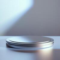 A silver object on a table with a light shining on it photo