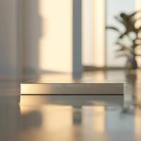 A white box sitting on a table in front of a window photo