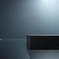 A black box sitting on a table with a light shining on it photo