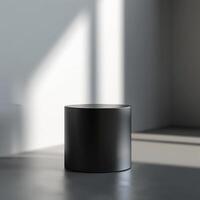 A black round table in a room with sunlight photo