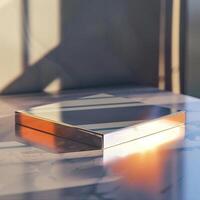 A square box sitting on a marble surface photo
