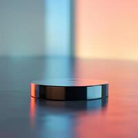 A black object sitting on a table in front of a colorful background photo