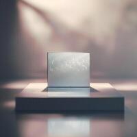 A white box sitting on a table in front of a bright light photo