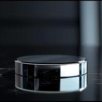 A black and white circular object sitting on a table photo