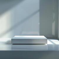 A white box sitting on a table in front of a window photo