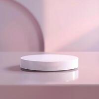 A white circular object on a table in front of a pink background photo