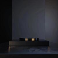 A black object on a table in front of a black wall photo