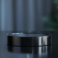A black circular object sitting on a table photo