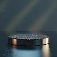 A black and silver circular object on a table photo