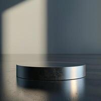 A round table with a black surface sitting in front of a wall photo