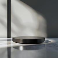 A black round object sitting on a table photo