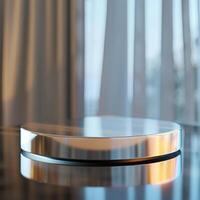 A round object on a table with a curtain in the background photo