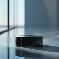 A black round object sitting on a table in front of a large window photo