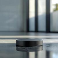 A black circular object sitting on a table photo