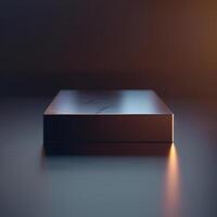 A black box sitting on a table with a light shining on it photo