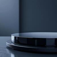 A black circular object on top of a table photo