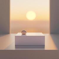 A white box sitting on a table with a sun setting behind it photo