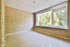 Empty room with wallpaper and window photo
