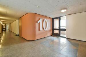 A hallway with a number ten painted on the wall photo