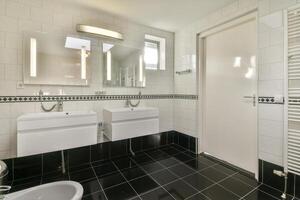 A bathroom with a sink and a mirror photo