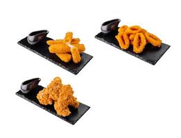 Deep fried breaded food platter presenting variety of options photo