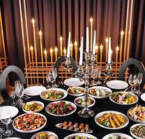 Elegant dining table setting with candlelight photo