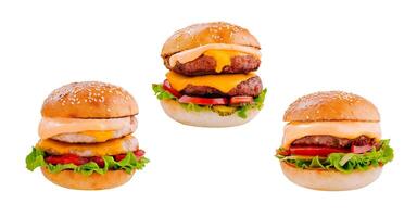 Three delicious burgers with beef, chicken cutlet, sauce, vegetables and cheese floating on white background photo