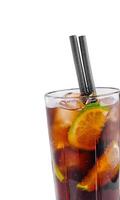 Cocktail with lime slices and ice cubes is standing on white background photo