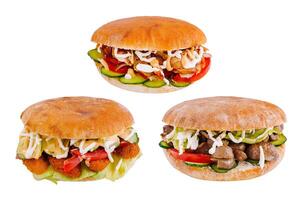 Three delicious pita sandwiches with various fillings are lying on white background photo